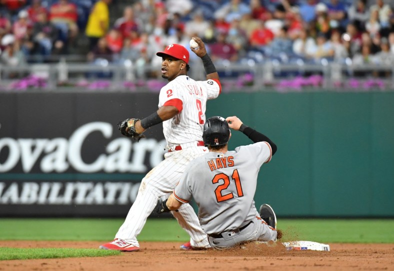 Sep 20, 2021; Philadelphia, Pennsylvania, USA; Philadelphia Phillies shortstop Jean Segura (2) turns a double play against Baltimore Orioles right fielder Austin Hays (21) during the second inning at Citizens Bank Park. Mandatory Credit: Eric Hartline-USA TODAY Sports