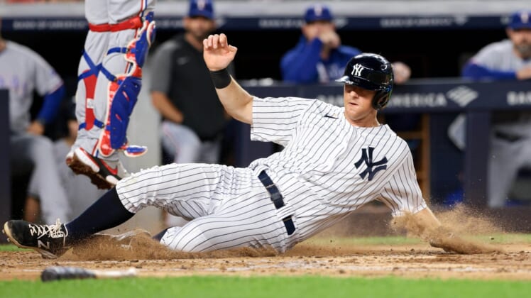 Sep 20, 2021; Bronx, New York, USA; New York Yankees second baseman DJ LeMahieu (26) scores on a RBI single by Aaron Judge (not pictured) against the Texas Rangers during the third inning at Yankee Stadium. Mandatory Credit: Vincent Carchietta-USA TODAY Sports