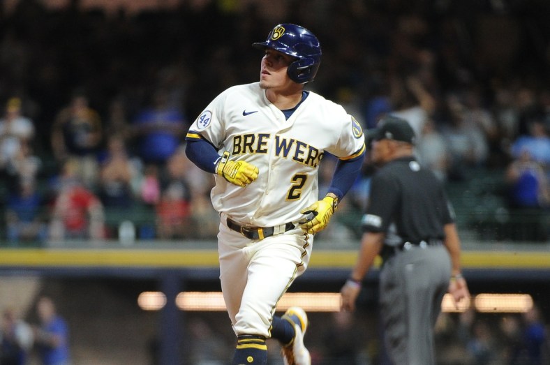Sep 20, 2021; Milwaukee, Wisconsin, USA;  Milwaukee Brewers third baseman Luis Urias (2) rounds the bases after hitting a home run against the St. Louis Cardinals in the second inning at American Family Field. Mandatory Credit: Michael McLoone-USA TODAY Sports