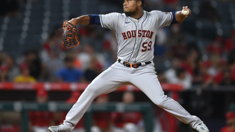 Sep 20, 2021; Anaheim, California, USA;  Houston Astros starting pitcher Framber Valdez (59) throws in the second inning of the game against the Los Angeles Angels at Angel Stadium. Mandatory Credit: Jayne Kamin-Oncea-USA TODAY Sports