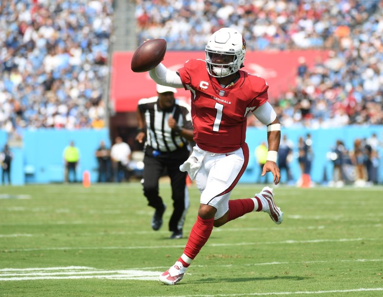 Sep 12, 2021; Nashville, Tennessee, USA; Arizona Cardinals quarterback Kyler Murray (1) runs for a touchdown against the Tennessee Titans at Nissan Stadium. Mandatory Credit: Christopher Hanewinckel-USA TODAY Sports