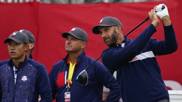 Sep 21, 2021; Kohler, Wisconsin, USA; Dustin Johnson watches his tee shot on the 1st hole during practice rounds for the 43rd Ryder Cup golf competition at Whistling Straits. Mandatory Credit: Michael Madrid-USA TODAY Sports