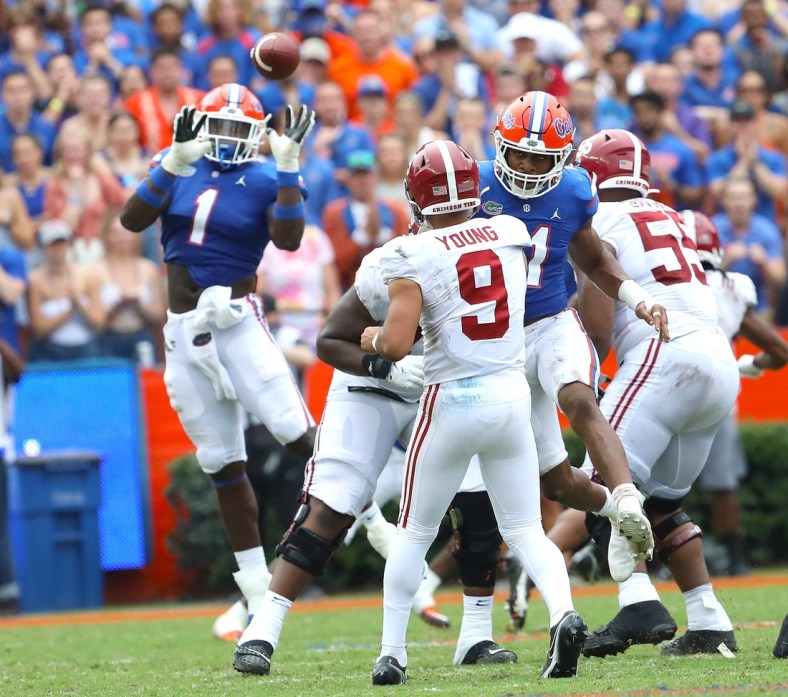 Florida Gators linebacker Brenton Cox Jr. (1) rises up to try for an interception but dropped it during the football game between the Florida Gators and The Alabama Crimson Tide, at Ben Hill Griffin Stadium in Gainesville, Fla. Sept. 18, 2021.

Flgai 09182021 Ufvs Bama 29