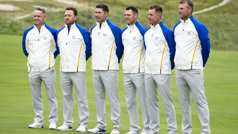 September 21, 2021; Kohler, Wisconsin, USA; Team Europe captain Padraig Harrington (third from left) poses with his vice-captains (L-R) Luke Donald, Graeme McDowell, Martin Kaymer, Henrik Stenson, and Robert Karlsson during a practice round for the 43rd Ryder Cup golf competition at Whistling Straits. Mandatory Credit: Kyle Terada-USA TODAY Sports