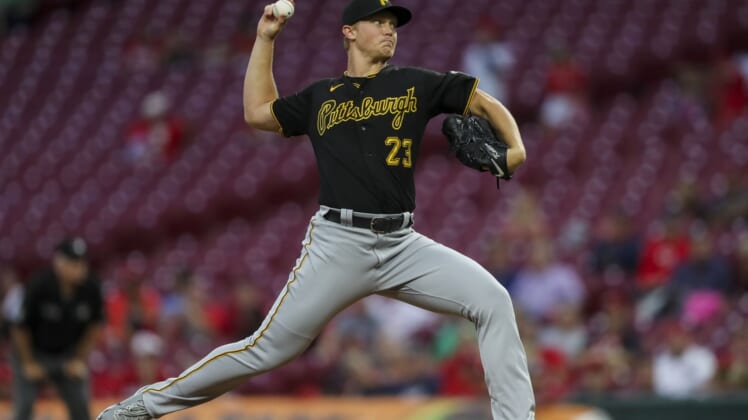 Sep 21, 2021; Cincinnati, Ohio, USA; Pittsburgh Pirates starting pitcher Mitch Keller (23) throws against the Cincinnati Reds in the first inning at Great American Ball Park. Mandatory Credit: Katie Stratman-USA TODAY Sports