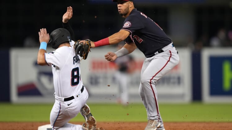 Sep 21, 2021; Miami, Florida, USA; Washington Nationals second baseman Luis Garcia (2) tags out Miami Marlins catcher Nick Fortes (84) while turning a double play in the 2nd inning at loanDepot park. Mandatory Credit: Jasen Vinlove-USA TODAY Sports