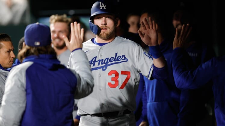 Sep 21, 2021; Denver, Colorado, USA; Los Angeles Dodgers right fielder Luke Raley (37) celebrates in the dugout after scoring against the Colorado Rockies in the fifth inning at Coors Field. Mandatory Credit: Isaiah J. Downing-USA TODAY Sports
