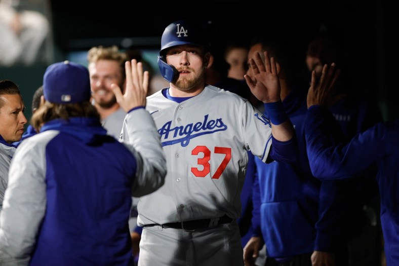 Sep 21, 2021; Denver, Colorado, USA; Los Angeles Dodgers right fielder Luke Raley (37) celebrates in the dugout after scoring against the Colorado Rockies in the fifth inning at Coors Field. Mandatory Credit: Isaiah J. Downing-USA TODAY Sports