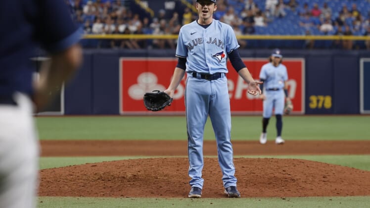 Sep 22, 2021; St. Petersburg, Florida, USA; Toronto Blue Jays pitcher Ryan Borucki (56) reacts as he hits Tampa Bay Rays center fielder Kevin Kiermaier (39) (not pictured ) with a pitch at Tropicana Field. Mandatory Credit: Kim Klement-USA TODAY Sports