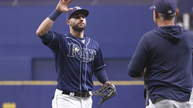 Sep 22, 2021; St. Petersburg, Florida, USA; Tampa Bay Rays center fielder Kevin Kiermaier (39) and manager Kevin Cash (16)  celebrate as they beat the Toronto Blue Jays to clinch a playoff spot at Tropicana Field. Mandatory Credit: Kim Klement-USA TODAY Sports