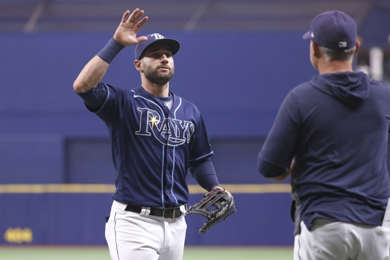 Sep 22, 2021; St. Petersburg, Florida, USA; Tampa Bay Rays center fielder Kevin Kiermaier (39) and manager Kevin Cash (16)  celebrate as they beat the Toronto Blue Jays to clinch a playoff spot at Tropicana Field. Mandatory Credit: Kim Klement-USA TODAY Sports