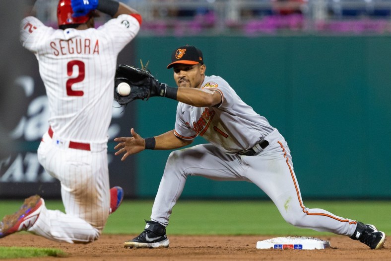 Sep 22, 2021; Philadelphia, Pennsylvania, USA; Baltimore Orioles shortstop Richie Martin (1) tags out Philadelphia Phillies shortstop Jean Segura (2) on a fielders choice during the third inning at Citizens Bank Park. Mandatory Credit: Bill Streicher-USA TODAY Sports