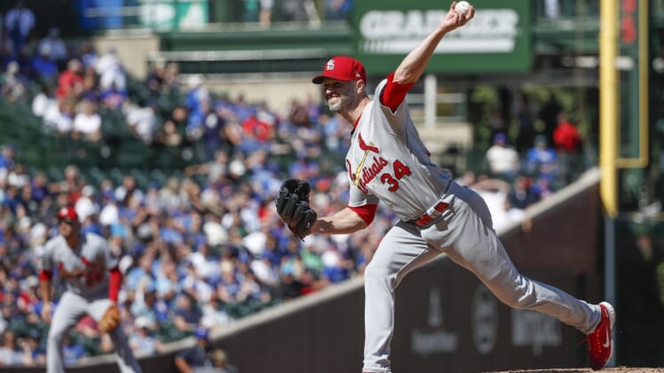 Sep 24, 2021; Chicago, Illinois, USA; St. Louis Cardinals starting pitcher J.A. Happ (34) delivers against the Chicago Cubs during the second inning of a Game 1 of the doubleheader at Wrigley Field. Mandatory Credit: Kamil Krzaczynski-USA TODAY Sports