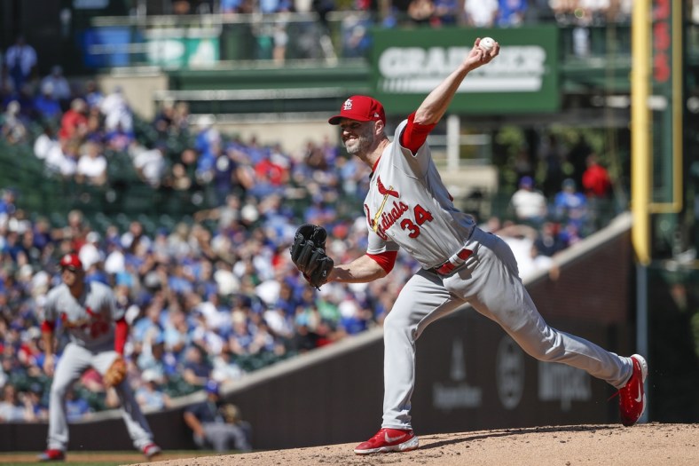 Sep 24, 2021; Chicago, Illinois, USA; St. Louis Cardinals starting pitcher J.A. Happ (34) delivers against the Chicago Cubs during the second inning of a Game 1 of the doubleheader at Wrigley Field. Mandatory Credit: Kamil Krzaczynski-USA TODAY Sports