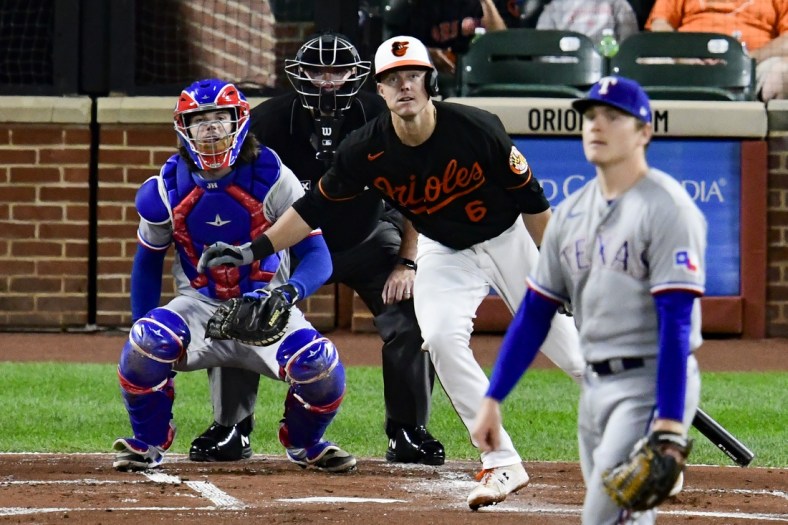 Sep 24, 2021; Baltimore, Maryland, USA; Baltimore Orioles third baseman Ryan Mountcastle (6) singles off Texas Rangers starting pitcher Spencer Howard (31) during the first inning  at Oriole Park at Camden Yards. Mandatory Credit: Tommy Gilligan-USA TODAY Sports