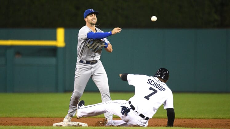 Sep 24, 2021; Detroit, Michigan, USA; Kansas City Royals second baseman Whit Merrifield (15) forces Detroit Tigers first baseman Jonathan Schoop (7) out at second base and throws for a double play during the third inning at Comerica Park. Mandatory Credit: Tim Fuller-USA TODAY Sports