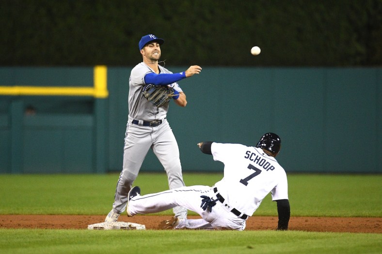 Sep 24, 2021; Detroit, Michigan, USA; Kansas City Royals second baseman Whit Merrifield (15) forces Detroit Tigers first baseman Jonathan Schoop (7) out at second base and throws for a double play during the third inning at Comerica Park. Mandatory Credit: Tim Fuller-USA TODAY Sports