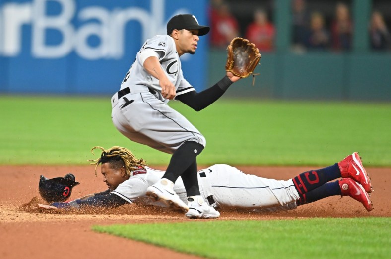 Sep 24, 2021; Cleveland, Ohio, USA; Cleveland Indians third baseman Jose Ramirez (11) steals second as Chicago White Sox second baseman Cesar Hernandez (12) waits for the throw during the fourth inning at Progressive Field. Mandatory Credit: Ken Blaze-USA TODAY Sports