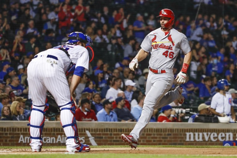 Sep 24, 2021; Chicago, Illinois, USA; St. Louis Cardinals first baseman Paul Goldschmidt (46) scores against the Chicago Cubs during the first inning of game 2 of a doubleheader at Wrigley Field. Mandatory Credit: Kamil Krzaczynski-USA TODAY Sports