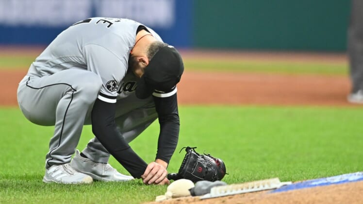 Sep 24, 2021; Cleveland, Ohio, USA; Chicago White Sox starting pitcher Dylan Cease (84) reacts after being hit in the arm with the ball off the bat of Cleveland Indians center fielder Bradley Zimmer (not pictured) during the sixth inning at Progressive Field. Mandatory Credit: Ken Blaze-USA TODAY Sports