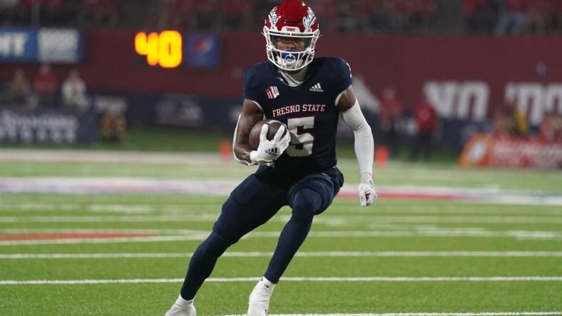 Sep 24, 2021; Fresno, California, USA; Fresno State Bulldogs wide receiver Jalen Cropper (5) runs the ball against the UNLV Rebels in the third quarter at Bulldog Stadium. Mandatory Credit: Cary Edmondson-USA TODAY Sports