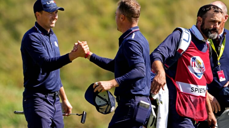 Sep 25, 2021; Haven, Wisconsin, USA; Team USA player Jordan Spieth and Team USA player Justin Thomas celebrate winning their match on the 18th green during day two foursomes rounds for the 43rd Ryder Cup golf competition at Whistling Straits. Mandatory Credit: Kyle Terada-USA TODAY Sports