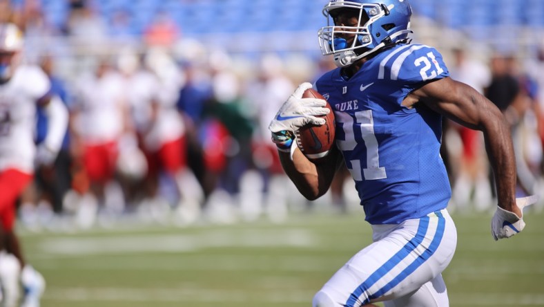 Sep 25, 2021; Durham, North Carolina, USA;  Duke Blue Devils running back Mataeo Durant (21) run with the football to make a touchdown during the 1st half of the game against the Kansas Jayhawks at Wallace Wade Stadium. Mandatory Credit: Jaylynn Nash-USA TODAY Sports