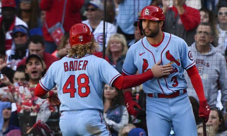 Sep 25, 2021; Chicago, Illinois, USA; St. Louis Cardinals center fielder Harrison Bader (48) celebrates with St. Louis Cardinals left fielder Dylan Carlson (3) after scoring during the seventh inning against the Chicago Cubs at Wrigley Field. Mandatory Credit: Matt Marton-USA TODAY Sports