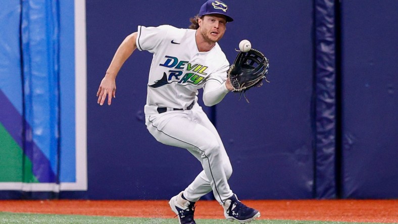 Sep 25, 2021; St. Petersburg, Florida, USA;  Tampa Bay Rays right fielder Brett Phillips (35) fields the ball in the second inning against the Miami Marlins at Tropicana Field. Mandatory Credit: Nathan Ray Seebeck-USA TODAY Sports