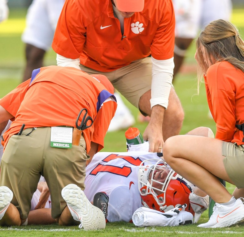 Clemson defensive lineman Bryan Bresee (11) is looked at by trainers after being injured during the third quarter at Carter-Finley Stadium in Raleigh, N.C., September 25, 2021.  The Tigers lost 27-21 in two overtimes game at Carter-Finley Stadium in Raleigh, N.C., September 25, 2021.

Ncaa Football Clemson At Nc State
