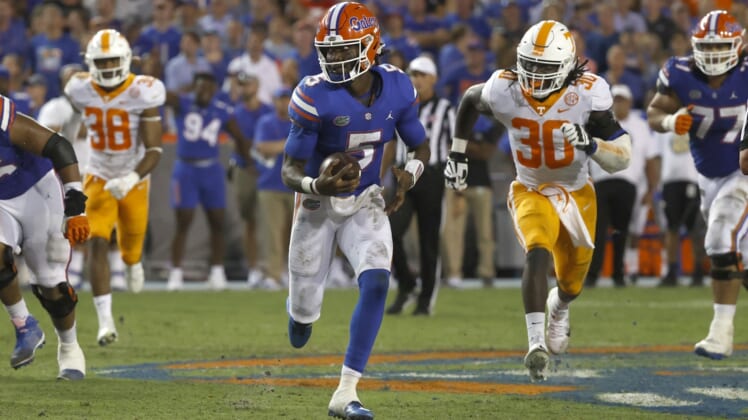 Sep 25, 2021; Gainesville, Florida, USA; Florida Gators quarterback Emory Jones (5) runs with the ball against the Tennessee Volunteers during the third quarter at Ben Hill Griffin Stadium. Mandatory Credit: Kim Klement-USA TODAY Sports