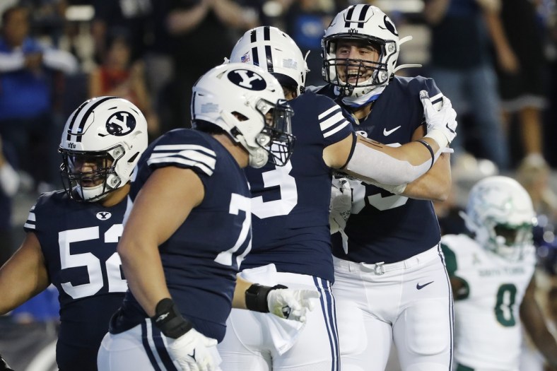 Sep 25, 2021; Provo, Utah, USA;  Brigham Young Cougars fullback Masen Wake (13) celebrates his touchdown with tight end Isaac Rex (83) in the first quarter against the South Florida Bulls at LaVell Edwards Stadium. Mandatory Credit: Jeffrey Swinger-USA TODAY Sports