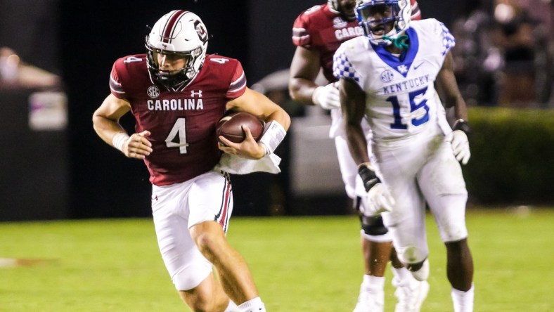 Sep 25, 2021; Columbia, South Carolina, USA; South Carolina Gamecocks quarterback Luke Doty (4) scrambles against the Kentucky Wildcats in the fourth quarter at Williams-Brice Stadium. Mandatory Credit: Jeff Blake-USA TODAY Sports