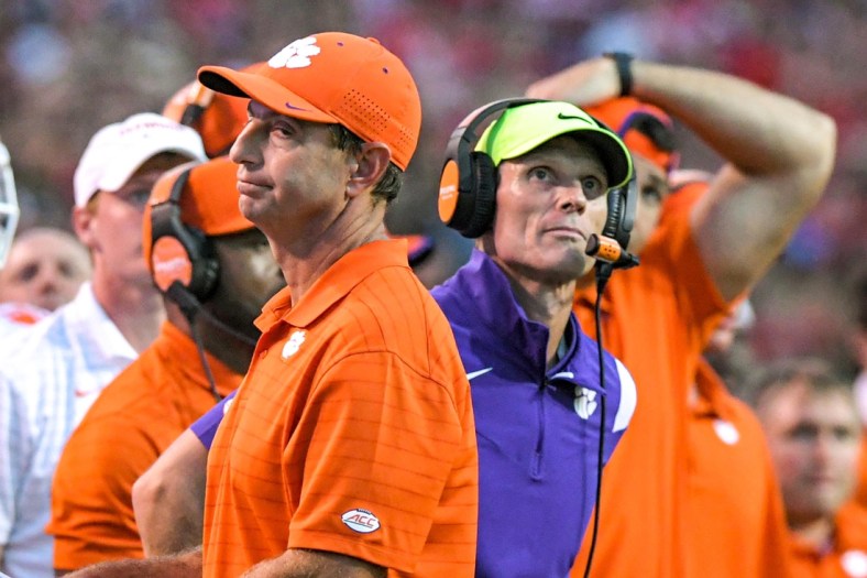 Clemson head coach Dabo Swinney and defensive coordinator Brent Venables react during the fourth quarter at Carter-Finley Stadium in Raleigh, N.C., September 25, 2021.

Ncaa Football Clemson At Nc State
