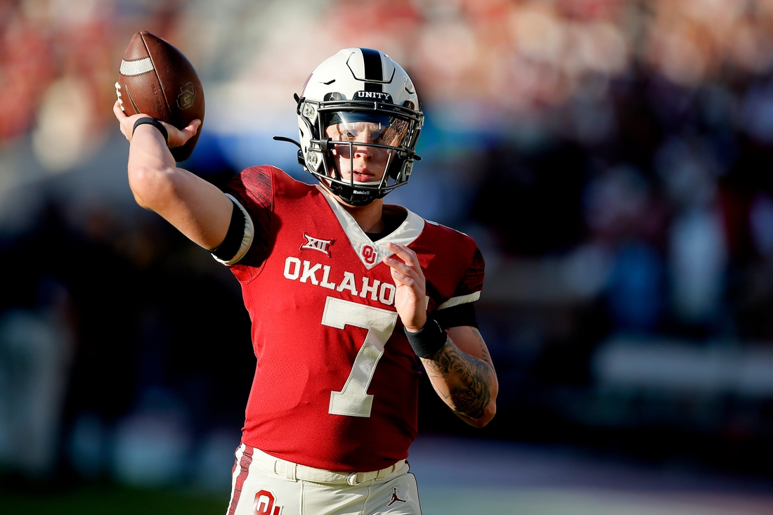 Oklahoma's Spencer Rattler (7) warms up before a college football game between the University of Oklahoma Sooners (OU) and the West Virginia Mountaineers at Gaylord Family-Oklahoma Memorial Stadium in Norman, Okla., Saturday, Sept. 25, 2021. Oklahoma won 16-13.

Lx10117