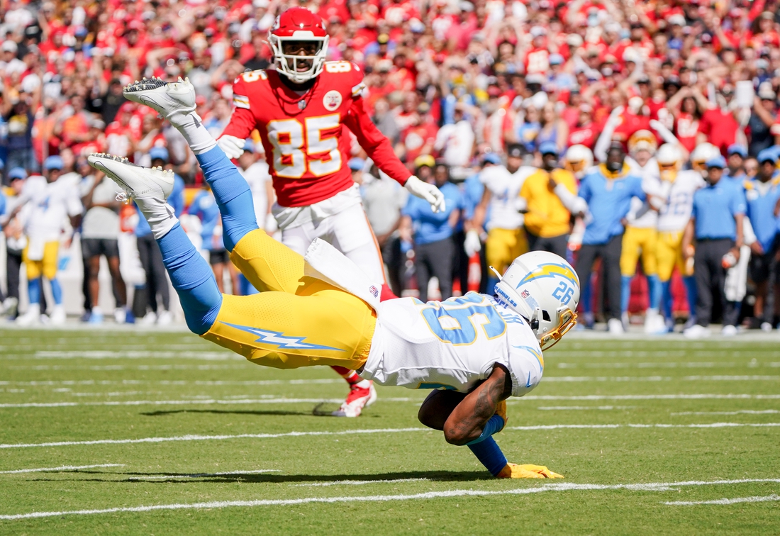 Sep 26, 2021; Kansas City, Missouri, USA; Los Angeles Chargers cornerback Asante Samuel Jr. (26) intercepts a pass intended for Kansas City Chiefs wide receiver Marcus Kemp (85) during the first half at GEHA Field at Arrowhead Stadium. Mandatory Credit: Denny Medley-USA TODAY Sports