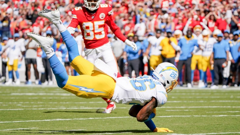 Sep 26, 2021; Kansas City, Missouri, USA; Los Angeles Chargers cornerback Asante Samuel Jr. (26) intercepts a pass intended for Kansas City Chiefs wide receiver Marcus Kemp (85) during the first half at GEHA Field at Arrowhead Stadium. Mandatory Credit: Denny Medley-USA TODAY Sports