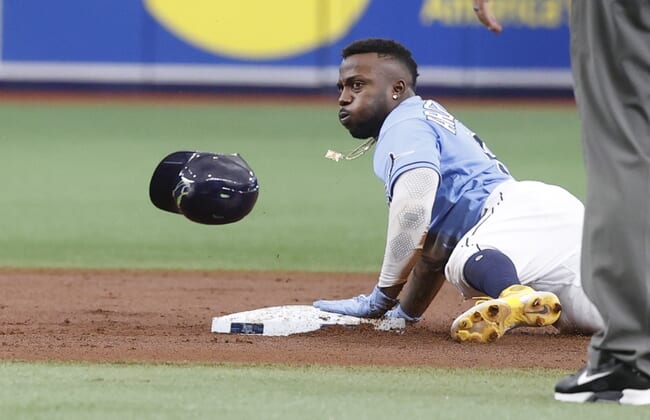 Sep 26, 2021; St. Petersburg, Florida, USA; Tampa Bay Rays left fielder Randy Arozarena (56) steals second base during the first inning against the Miami Marlins at Tropicana Field. Mandatory Credit: Kim Klement-USA TODAY Sports