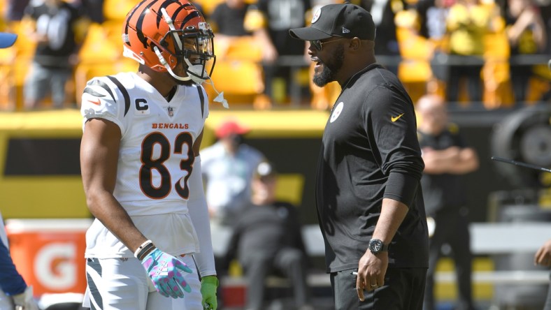 Sep 19, 2021; Pittsburgh, Pennsylvania, USA;  Cincinnati Bengals wide receiver Tyler Boyd (left) meets with Pittsburgh Steelers head coach Mike Tomlin before their game at Heinz Field. Mandatory Credit: Philip G. Pavely-USA TODAY Sports