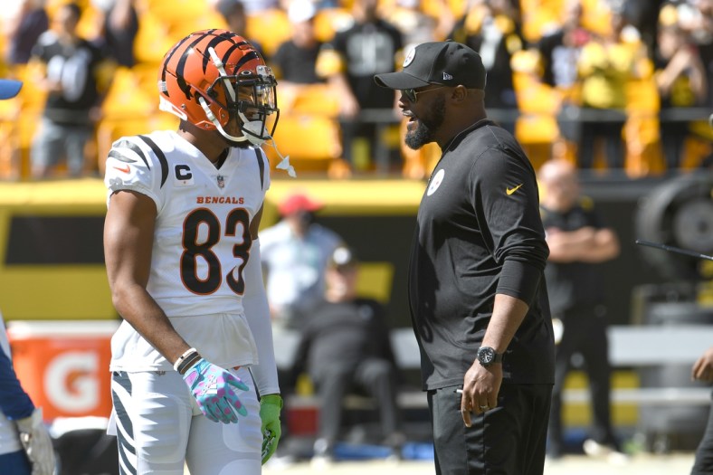 Sep 19, 2021; Pittsburgh, Pennsylvania, USA;  Cincinnati Bengals wide receiver Tyler Boyd (left) meets with Pittsburgh Steelers head coach Mike Tomlin before their game at Heinz Field. Mandatory Credit: Philip G. Pavely-USA TODAY Sports