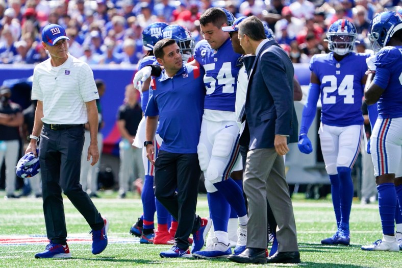 New York Giants inside linebacker Blake Martinez (54) is helped off the field in the first half at MetLife Stadium on Sunday, Sept. 26, 2021, in East Rutherford.

Nyg Vs Atl