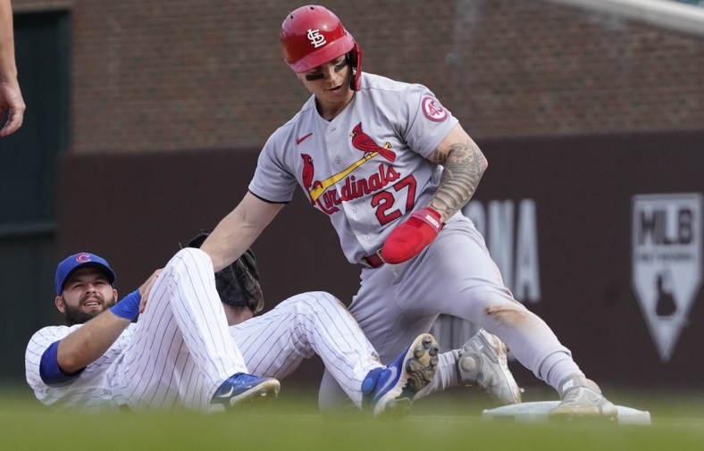 Sep 26, 2021; Chicago, Illinois, USA; St. Louis Cardinals left fielder Tyler O'Neill (27) steals second base as Chicago Cubs second baseman David Bote (13) makes a late tag during the sixth inning at Wrigley Field. Mandatory Credit: David Banks-USA TODAY Sports