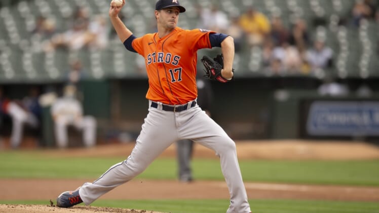 Sep 26, 2021; Oakland, California, USA; Houston Astros starting pitcher Jake Odorizzi (17) delivers a pitch against the Oakland Athletics in the first inning at RingCentral Coliseum. Mandatory Credit: D. Ross Cameron-USA TODAY Sports