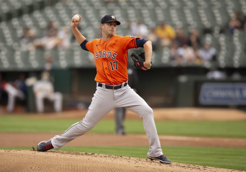 Sep 26, 2021; Oakland, California, USA; Houston Astros starting pitcher Jake Odorizzi (17) delivers a pitch against the Oakland Athletics in the first inning at RingCentral Coliseum. Mandatory Credit: D. Ross Cameron-USA TODAY Sports
