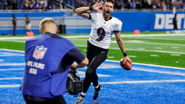 Baltimore Ravens kicker Justin Tucker celebrates as he exits the field, after his record 66-yard field goal lifted the Ravens past the Detroit Lions, 19-17, at Ford Field in Detroit on Sunday, Sept. 26, 2021.
