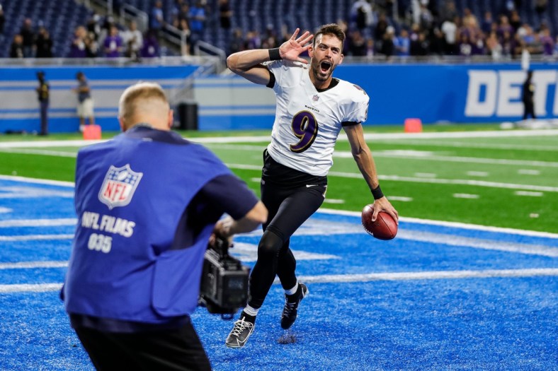 Baltimore Ravens kicker Justin Tucker celebrates as he exits the field, after his record 66-yard field goal lifted the Ravens past the Detroit Lions, 19-17, at Ford Field in Detroit on Sunday, Sept. 26, 2021.