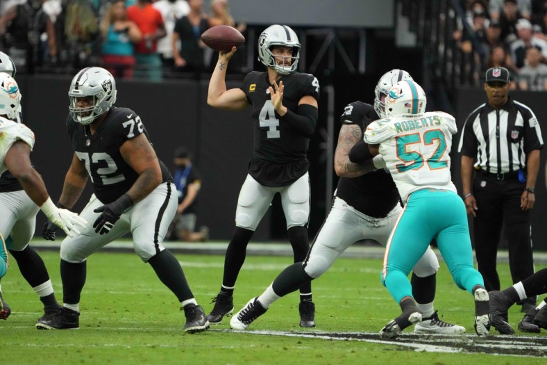 Sep 26, 2021; Paradise, Nevada, USA; Las Vegas Raiders quarterback Derek Carr (4) throws the ball in the first quarter against the Miami Dolphins at Allegiant Stadium. Mandatory Credit: Kirby Lee-USA TODAY Sports