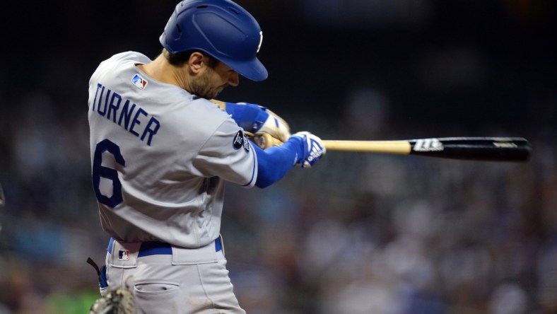 Sep 26, 2021; Phoenix, Arizona, USA; Los Angeles Dodgers shortstop Trea Turner (6) hits a double against the Arizona Diamondbacks during the third inning at Chase Field. Mandatory Credit: Joe Camporeale-USA TODAY Sports