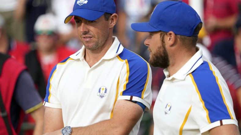 Sep 26, 2021; Haven, Wisconsin, USA; Team Europe player Rory McIlroy and Team Europe player Tyrrell Hatton look on from the 15th green during day three singles rounds for the 43rd Ryder Cup golf competition at Whistling Straits. Mandatory Credit: Michael Madrid-USA TODAY Sports