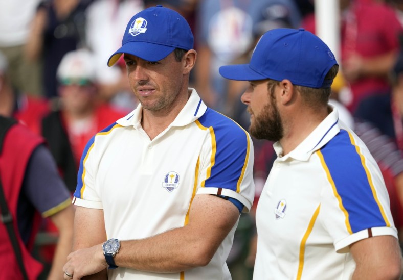 Sep 26, 2021; Haven, Wisconsin, USA; Team Europe player Rory McIlroy and Team Europe player Tyrrell Hatton look on from the 15th green during day three singles rounds for the 43rd Ryder Cup golf competition at Whistling Straits. Mandatory Credit: Michael Madrid-USA TODAY Sports